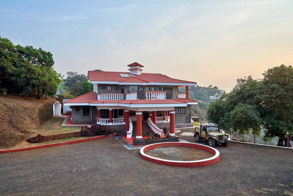 The Cliffhanger villa with its red-tiled roof, stone walls and colonnaded porch